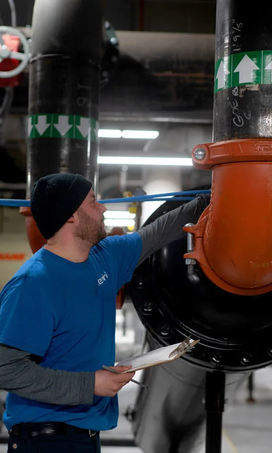 Photo of a CenTrio plant operator in Chicago performing maintenance on equipment.