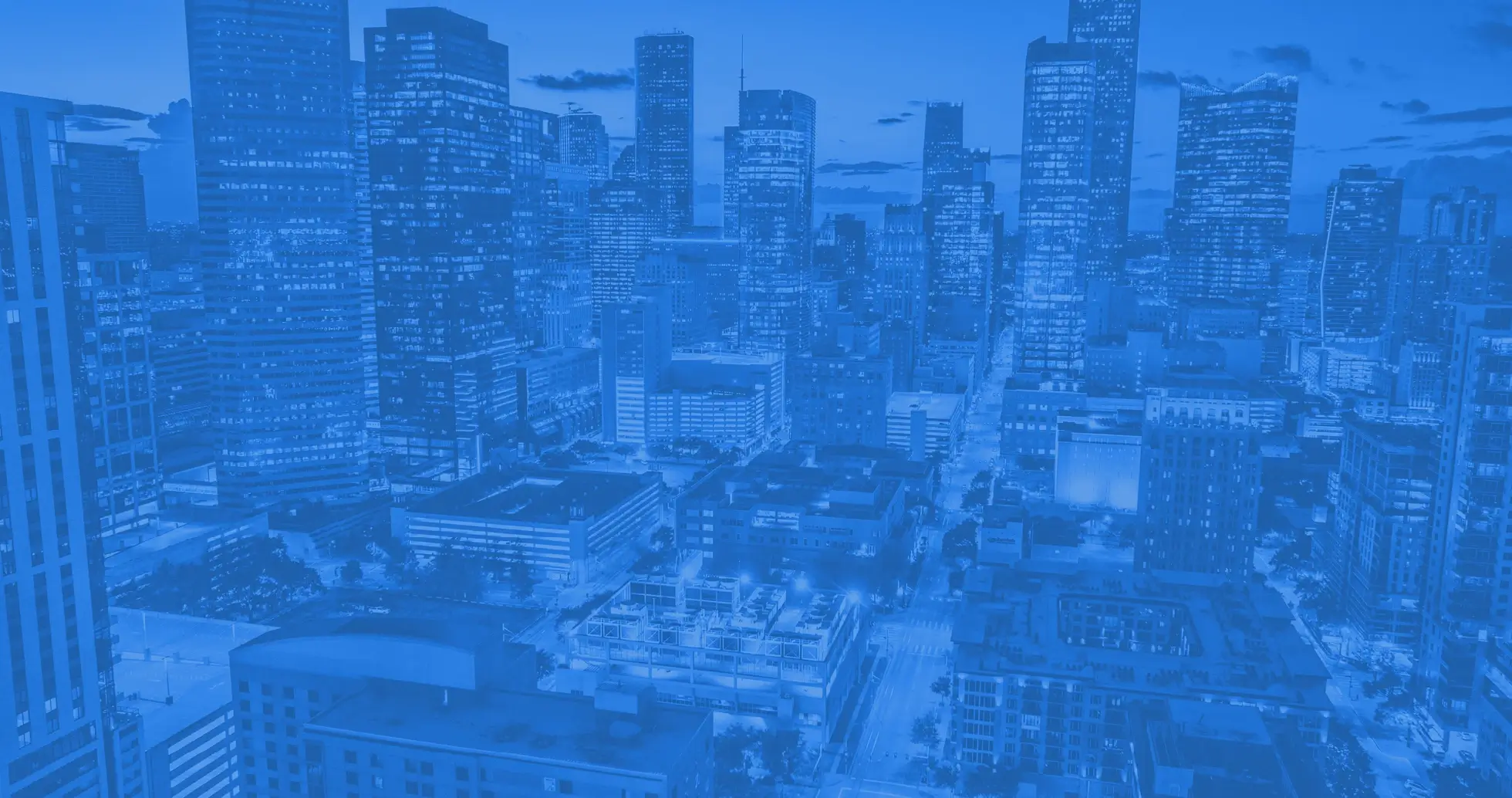 Video background showing a modern city skyline representing innovation, connectivity, and digital transformation