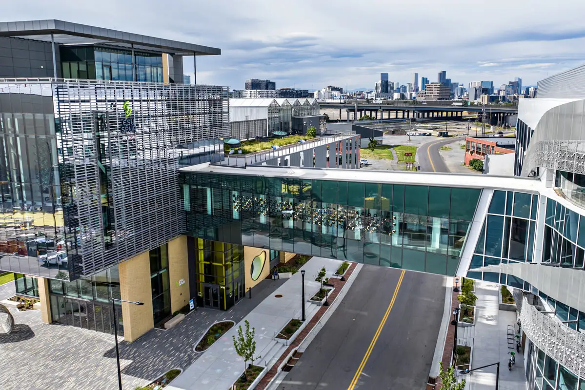 High view of buildings and sky bridge from the CenTrio supported National Western Center campus.