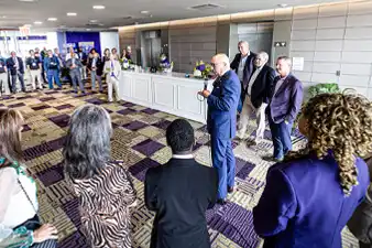 LSU board members and CenTrio Leadership gathering in a suite at LSU Stadium to celebrate the Utility Modernization Initiative completion.