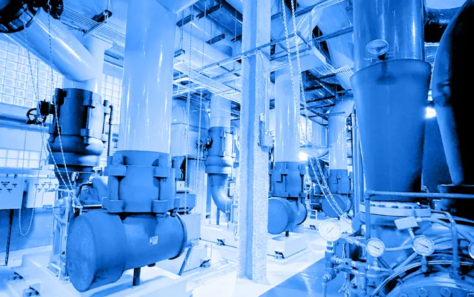 Blue color overlay photo showing the inside of a CenTrio Cooling Plant