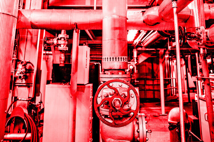 Red color overlay photo showing the inside of a CenTrio Heating Plant