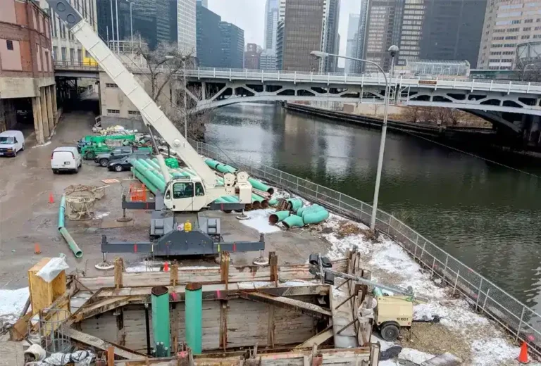 Construction project with a crane moving piping as we connect a new customer to our existing CenTrio plant.
