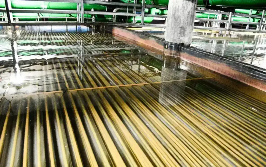 Image of our ice storage room at a CenTrio Plant in Chicago, IL showing sitting water and the coils underneath that the ice forms on.