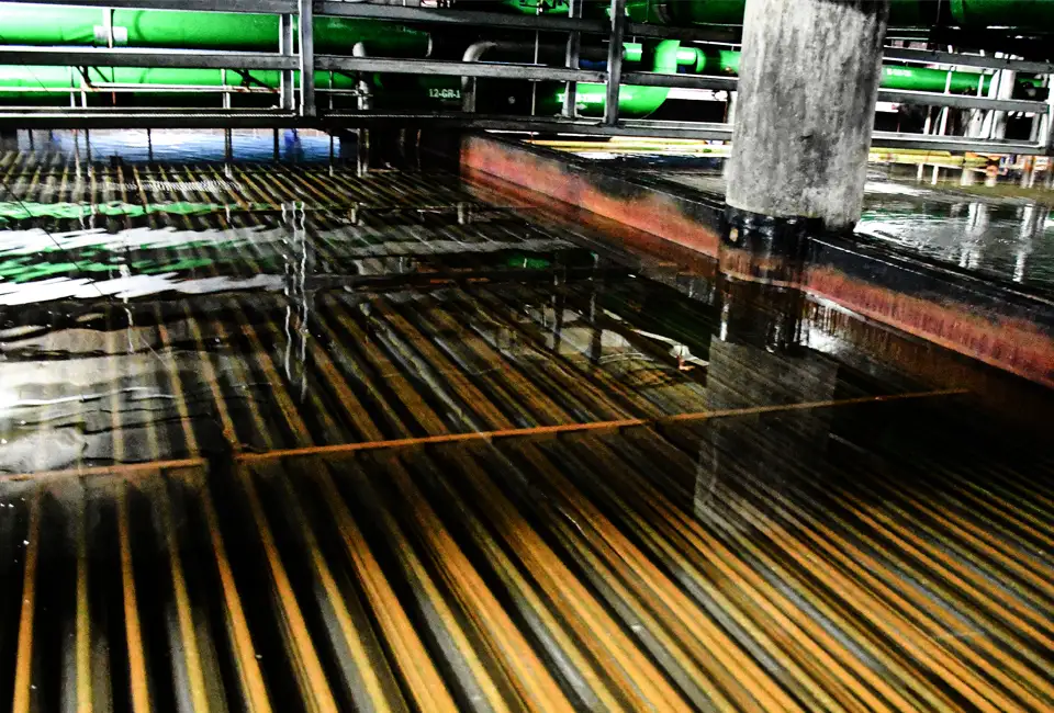 Image of our ice storage room at a CenTrio Plant in Chicago, IL showing sitting water and the coils underneath that the ice forms on.