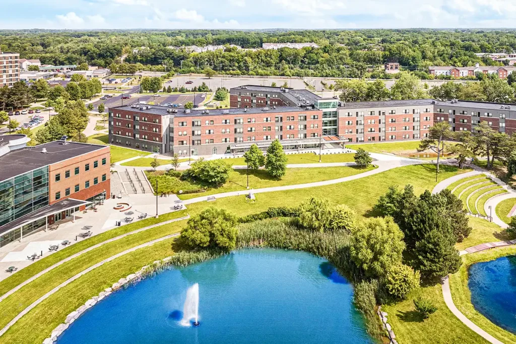 aerial view of university campus with lake and buildings supported by district energy systems