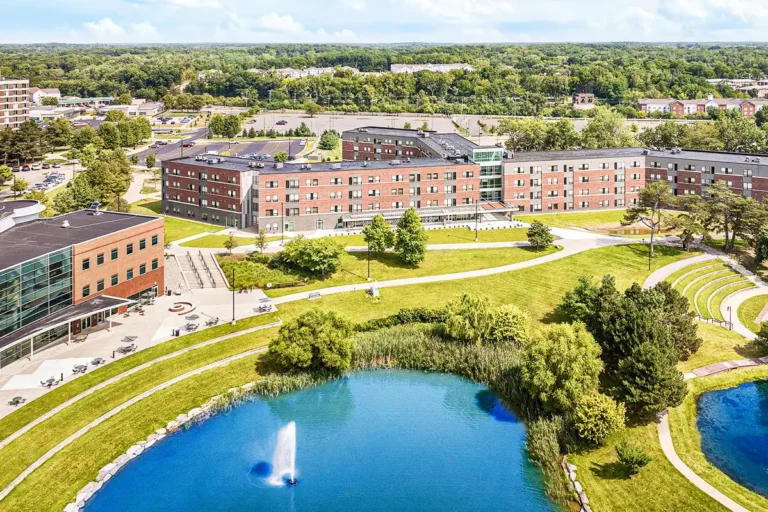 aerial view of university campus with lake and buildings supported by district energy systems