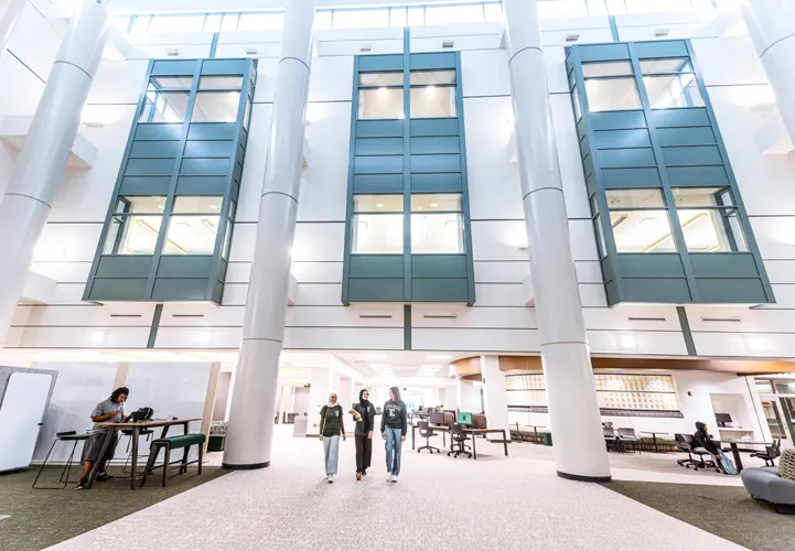 interior of university campus building with students and modern facilities supported by district energy systems