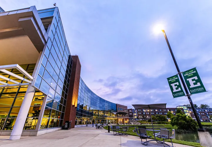 university campus outdoor walkway with students and buildings supported by district energy systems